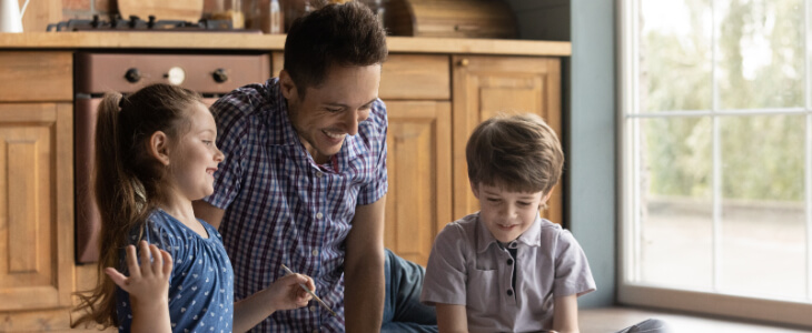 image of dad playing with his kids