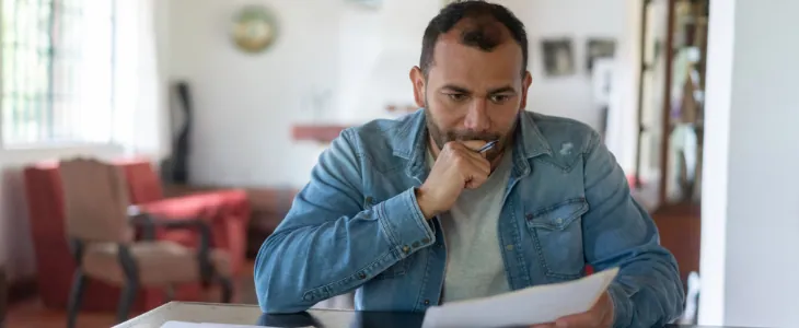 image of man worried about his bills